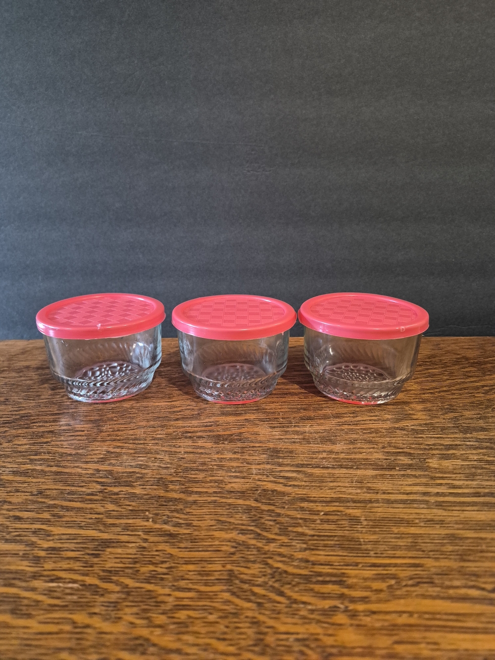 Set of three small, clear glass jars/containers
